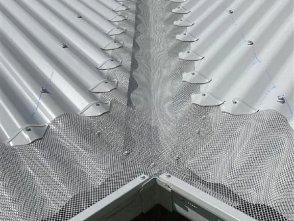 Aluminium mesh valley guard kit installed at a roof junction